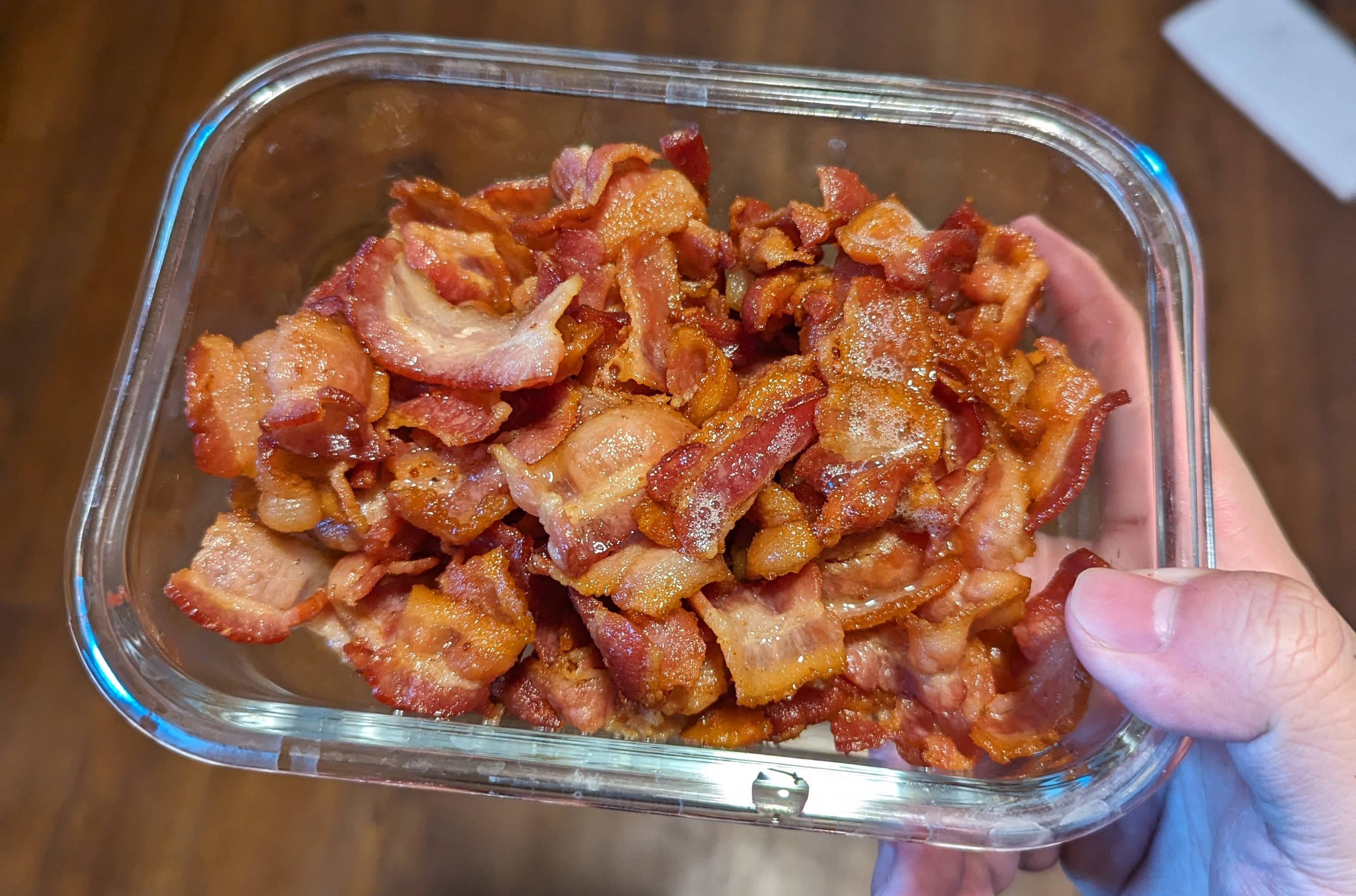 A container with one pound of cooked bacon.